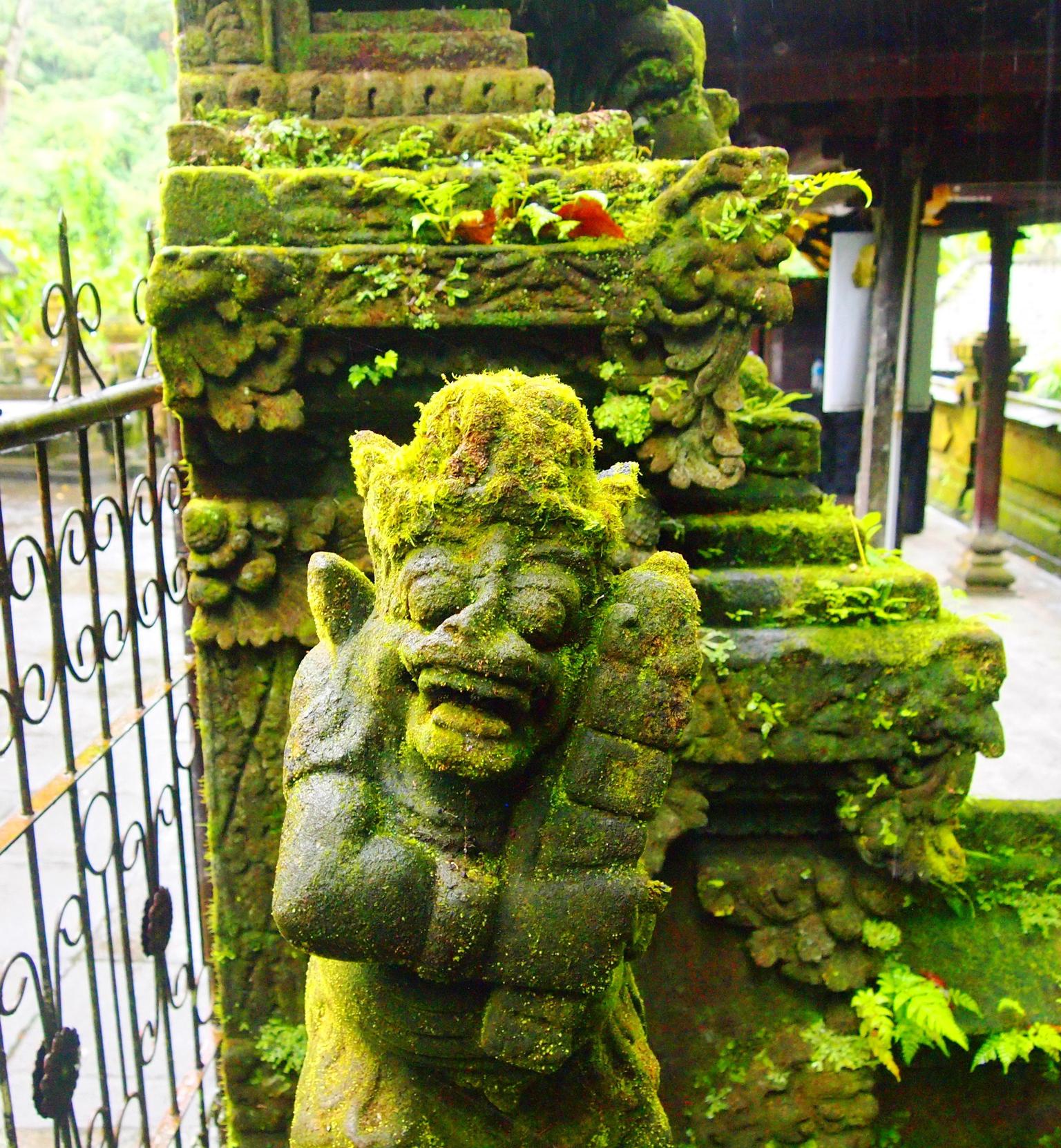 Moss covered statue at Bali Pura Luhur Batukaru Temple