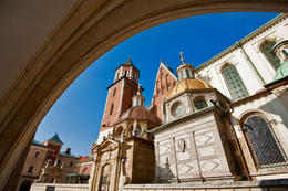 Photo of Wawel Cathedral in Krakow viewed from behind a gothic arch Wawel Cathedral in Krakow viewed from behind a gothic arch - September 2011