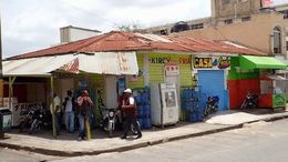 Photo of Corner shop A quick view of locals in one of the many villages we passed through. , Allan - September 2015