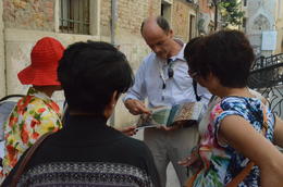 Photo of Our guide, Stefano showing us illustrations in his book Stefano, well prepared with his books, explaining to us the mechanics of the buildings , Rosy Yung - July 2014