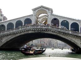 Photo of Railto bridge spanning the canal A view of one of the many bridges spanning the canals. Notice the crowds on the bridge watching the Gondolas as they cruise underneath with their passengers., HONG HONG T - November 2009