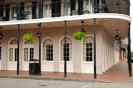 Photo of French Quarter, New Orleans building, Bourbon Street Restaurant in New Orleans' French Quarter with wrought iron balconies and gas style lamps, etc. on Bourbon Street - May 2011