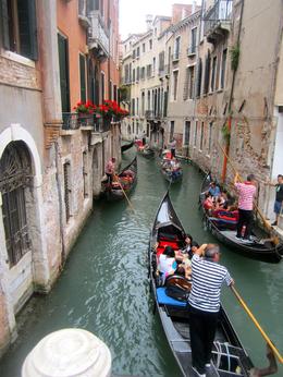 Photo of Gondolas on a small canal My daughter and I toured Italy as her high school graduation present. , Melanie V - July 2013