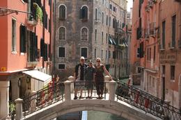Photo of Venice in One Day tour: Over another canal on another bridge My husband, son and I on one of the many beautiful bridges in Venice. Every picture looks like a movie set! - July 2009
