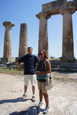 Photo of Delphi Day Trip from Athens Ancient Corinth, My husband and I are in this picture. In front of us we had the view of the two seas divided by the Corinth Canal, and behind the ruins of the Ancient Corinth. , Isabel A - July 2011