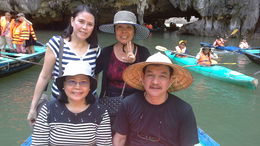 Photo of Cruising Halong Bay Islands in a Bamboo Boat Its amazing to see the beauty of Halong Bay up close in a bamboo boat! Our boat lady easily guided our small boat in and out of caves and even took our photos. A truly memorable travel experience. , ritamarieazarcon - October 2015