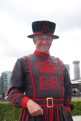 Photo of Our Beefeater Guide to the Tower of London Our guide met us at the gate. There were some 30 people in our group despite it being a grey day that threatened (and did produce) rain while we were there., Judith N - July 2010