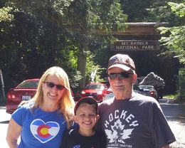 Photo of Entrance of Mt Ranier National Park 3 generations getting out to get a pic of the National park sign , Pamela G - August 2016