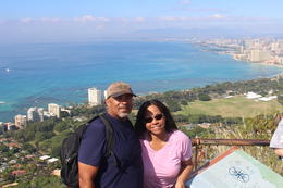 Photo of A view from the top! Bruce and Julie (my husband and I) at the top of Diamond Head. Awesome viw of Honolulu in the background. , Bruce F - December 2014