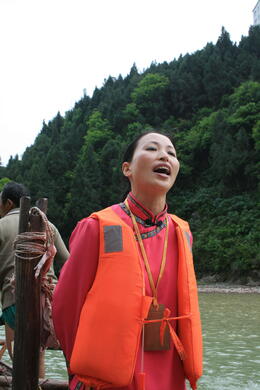 Photo of yangtze river guide singing.JPG Our Tujia minority guide signing a local song for us during our excursion to Shennong Stream....She was amazing!, Bing - May 2012