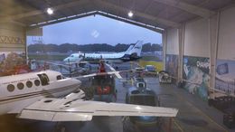 Photo of Plane Hangar You depart from behind the airport, not the main entrance since its local flight. In the waiting room there is a mini cafeteria with sanwiches, cookies and drinks, very expensi The plane is a ... , JAM - November 2015