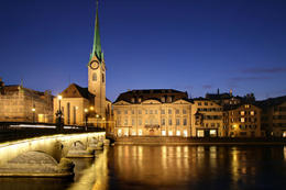 Photo of Zurich at twilight, Switzerland Sunset over the western side of Zurich across the Limmat river in the vicinity of Munster Bridge with Fraumunster Church - May 2011