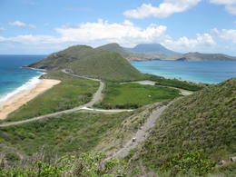 Photo of Panoramic View.... Taken near Frigate Bay. Nevis is in the centre with cloud covering; Atlantic Ocean is on left; Caribbean Sea on the right. Breathtaking view! , Robert H - May 2013