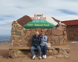 Photo of PIKES PEAK COG RAILWAY SUMMIT Janet and Fred, freezing at the summit of Pikes Peak. A cog railway ride from Manitou Springs. Bet you dont go there, Viator! , F B - March 2011