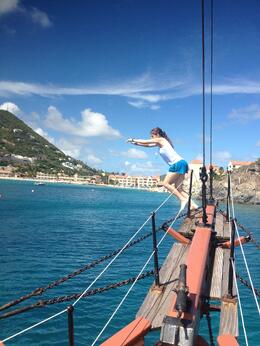 Photo of Becca walking the plank While anchored we were able to jump, dive, or even flip off the plank. Great fun! , Brian M - October 2013
