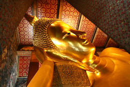 Photo of Reclining buddha within the Wat Pho in Bangkok Thailand Reclining buddha within the Wat Pho in Bangkok, Thailand - June 2011