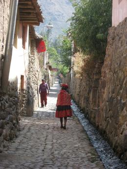 Photo of Street in Ollantaytambo View down a street in Ollantaytambo. Local woman wearing traditional clothing., Bandit - December 2010