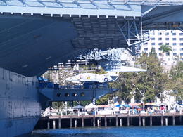 Photo of USS Midway Aircraft Carrier, San DIego Bay. San Diego Harbor Tour - Friday, August 15, 2014. Aircraft on the USS Midway, as seen from the harbor cruise ship looking onto downtown San Diego. , Carrie Mc - August 2014