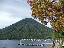 Photo of Mt Nantai from Lake Chuzenji The first of the autumn colours in late September frame the view of Mt Nantai., Robin H - October 2008