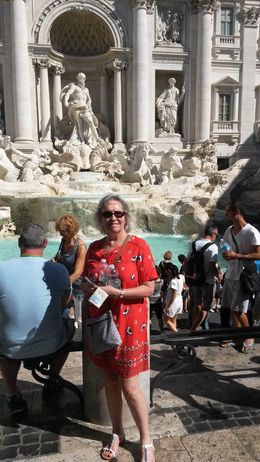 Photo of Trevi Fountain.Wonderful site.Exactly as expected My wife standing in front of a wonderful site. , William H - August 2016