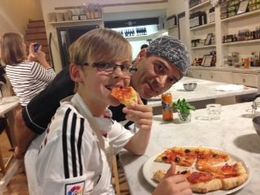 Photo of The best Pizza in town! Mackenzie eating his home made Pizza at the Cookery class in Florence , Sharon F - November 2015