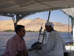 Photo of Aswan Felucca Our skipper was the oldest felucca caption on the Nile - not a word of English so we were glad to have our guide with us! - June 2008