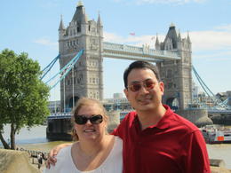 Photo of The Tower of London My husband and I on the Tower of London walls with the Tower Bridge in the background. , Monica B - July 2014