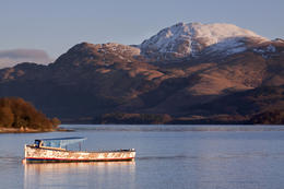 Photo of Boat on Loch Lomond, in dawn light, a snow-capped Ben Lomond behind Boat on Loch Lomond, in dawn light, a snow-capped Ben Lomond behind - May 2011
