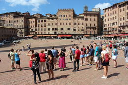 Photo of Piazza del Campo in Siena Our tour group learning about the Palio di Siena, the horse race that takes place twice a year in Siena's central square. Would be amazing to visit while the race is on. , Antony I - June 2014