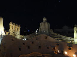 Photo of LaPedrera rooftop @ night Guadi incorporated what looks like warrior figures into the various shafts and chimneys , Robert E - July 2014