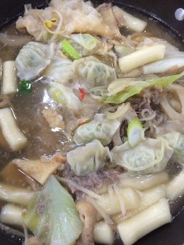 Photo of Rice Cake Huge bowl of broth with rice cakes, noodles I think they were made out of sweet potato, beef, and veggies. I'm sure I'm missing other key ingredients but you get the gist. , Jan - April 2015