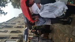 Photo of Cold and Rainy Our friends on the trip with us in the middle standing in the pouring rain trying to understand our guide. , Terri S - October 2015