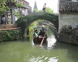 Photo of Gondola Ride on a Suzhou canal Group of tourists riding in one of the many gondolas on a canal in Suzhou , Marion S - June 2013