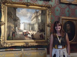 Photo of A beautiful La Scala painting and tour guide! Our wonderful guide, Fedra, with a historic La Scala painting and another great story. , Cynthia F - July 2014
