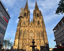 Photo of Cologne cathedral towers. The evening sunset light reflects on to the cathedral giving it a warm golden colour. , David Lally - September 2015