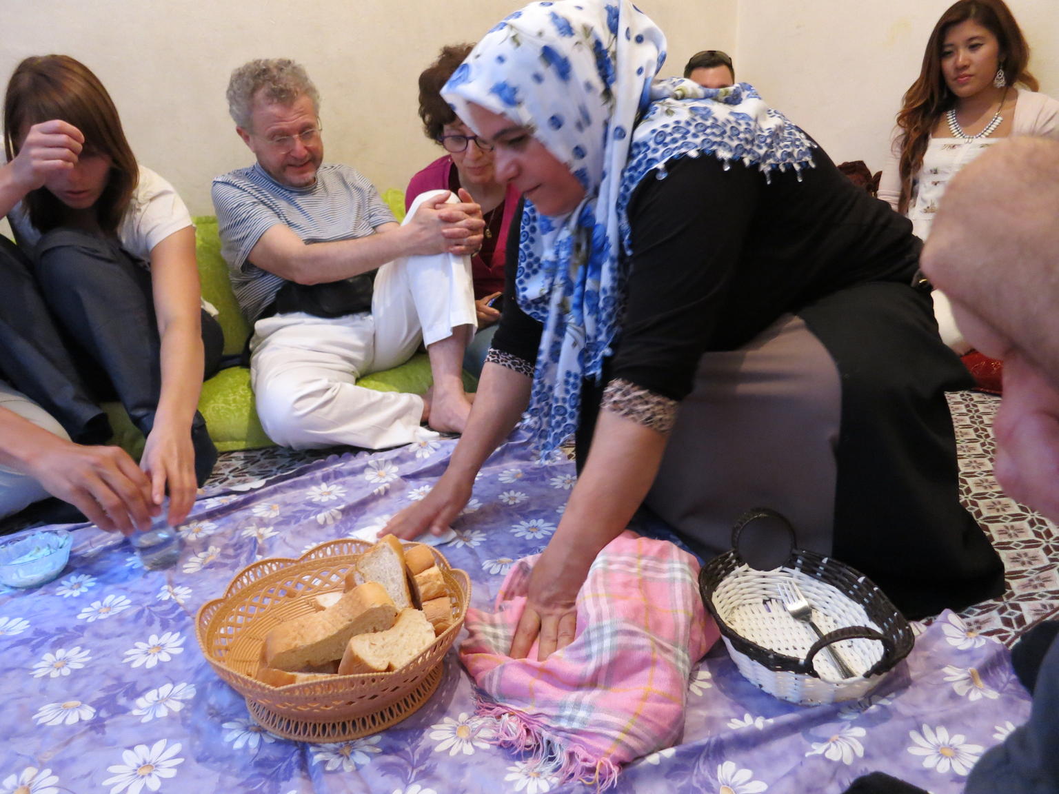 our host bringing bread