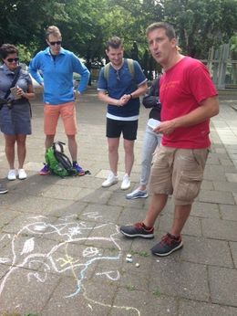 Photo of Modern Berlin Bike Tour June 2016 Andrew gives us a sidewalk history lesson on Germany during a bike tour in Berlin. , Heidi F - July 2016
