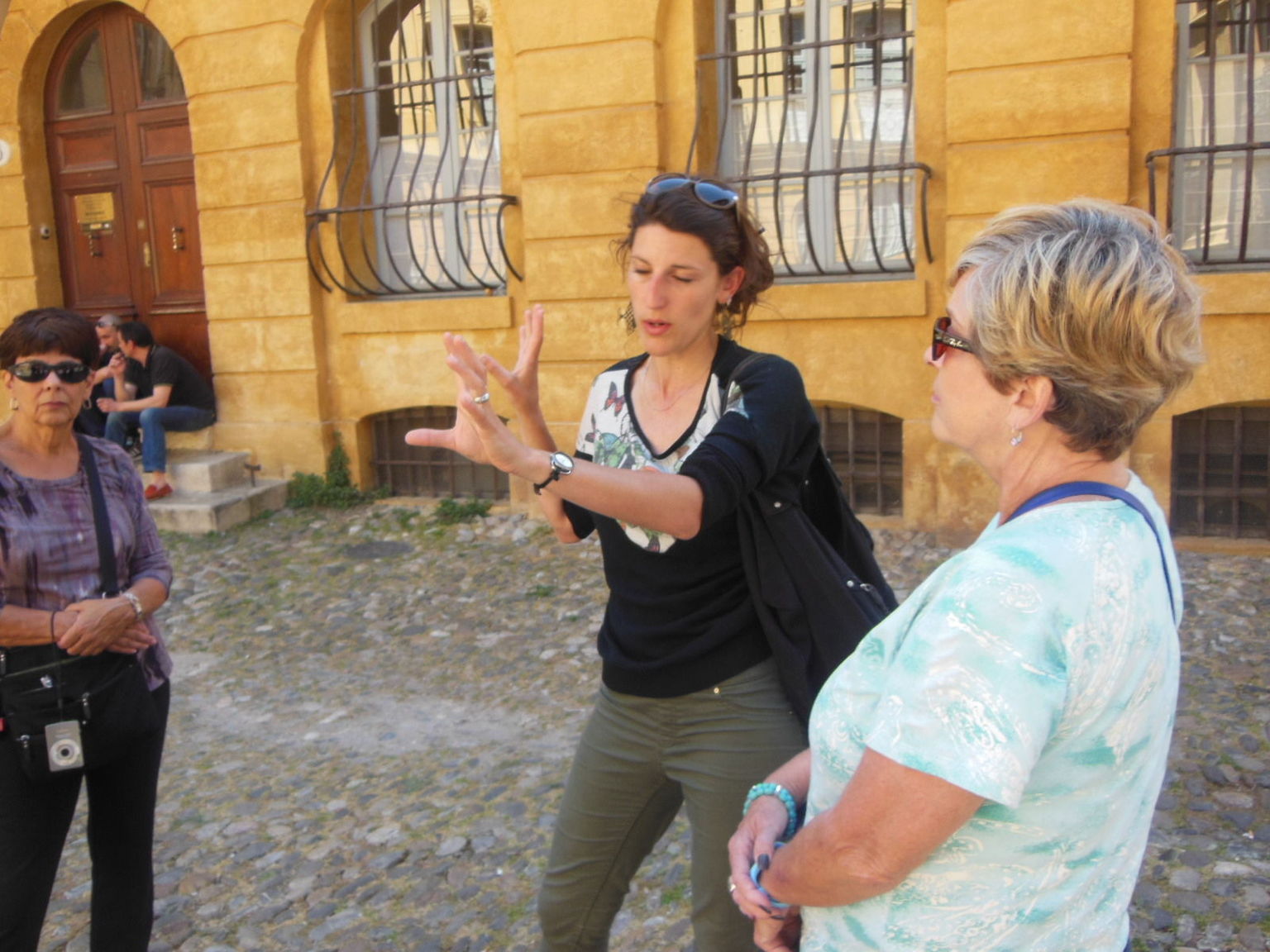 Veronique explaining a historic site in Aux en Provence