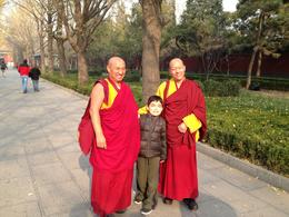 Photo of Our 7 year old's first trip to China! During our tour to the Lama Temple, our son met students traveling to the temple as well. , Vanessa V - February 2013