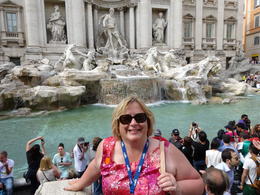Photo of The Trevi Fountain That's me, standing in front of the Trevi Fountain, one of the most romantic spots in all of Rome. We were on our 30th Anniversary trip - my husband would rather take the pictures than be in them. , Kristin L - May 2014