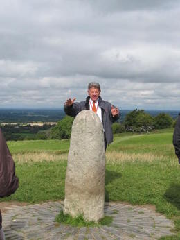 Photo of Standing Stone Our Tour Guide/Bus Driver, Michael, next to a Standing Stone at the Hill of Tara , MommaK - September 2013