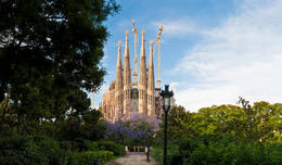 Photo of Barcelona Sagrada Familia Gaudi The iconic spires and ornate Passion façade of Antoni Gaudí's Sagrada Família, the immense church still being built in L'Eixample district of central Barcelona framed by the colorful ... - May 2011