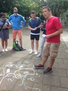 Photo of Modern Berlin Bike Tour June 2016 Andrew gives us a sidewalk history lesson during our tour of Berlin. , Heidi F - July 2016
