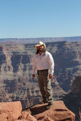 Photo of Grand Canyon with Brett our fabulous tour guide Take this tour - you won't be disappointed. Here's Brett, standing on the edge! He is a fantastic guide, made our day trip to the Grand Canyon very very special indeed! , June D - October 2012