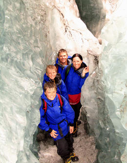 Photo of Brisbane's Newell family at Franz Josef Glacier January 6 2012 Martin and Natalie Newell with their sons Lachlan and Cameron explore one of the ice tunnels at Franz Josef Glacier as part of the full-day tour. , Natalie N - January 2012