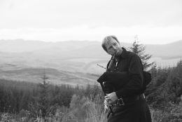 Photo of Impromptu Bagpipe Serenade Mac, our tour guide, at our last scenic stop in the Highlands, surprises everyone by breaking out his bagpipe -- very impressive! , Scott R - November 2015