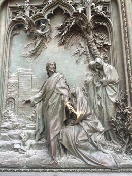 Photo of One of the thousands of sculptures on the outside of the Duomo This is on the huge doors of the Duomo. , Kristyne T - August 2016