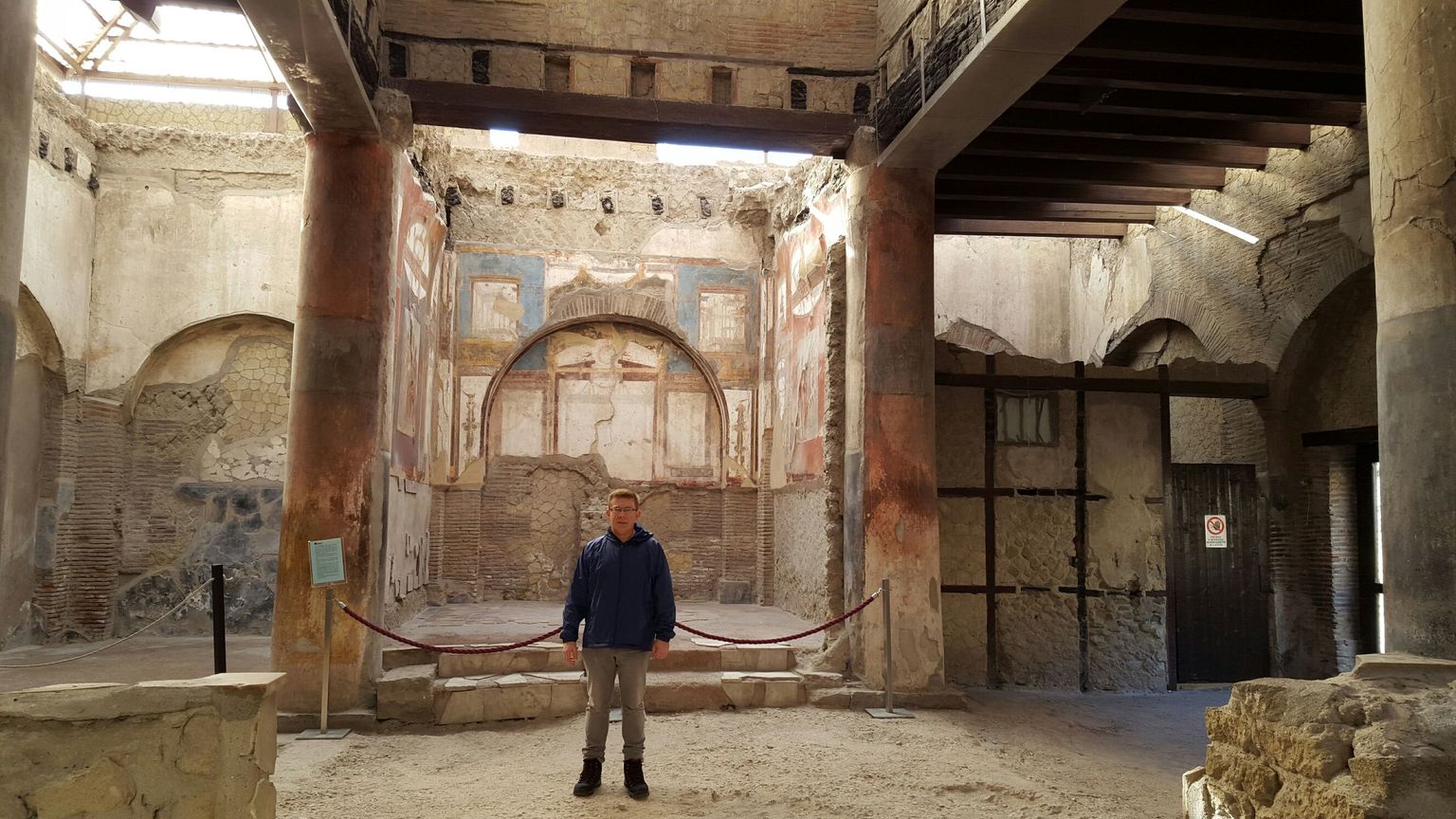view of old mosaics on walls inside Herculaneum complex