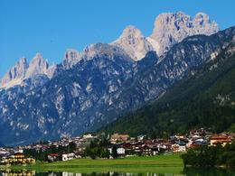 Photo of Village at the base of the Dolomites, Italy ..or Dolomitis, as the Italians say! Our wonderful guide, Alessio, told us that we were so fortunate to have weather this day where the visibility was infinite and the peaks were not in the clouds! , Lis - October 2011