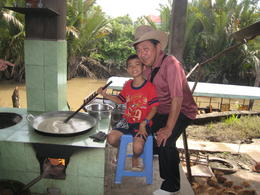 Photo of My hardworking friend This boy works in the morning in the coconut candy factory and goes to school by noon. , Victor - January 2011